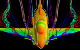 Hier wird das Strömungsverhalten eines neuen Flugzeugs im Rechner untersucht. Die Luftverwirbelungen erkennt man an den bunten Bändern, die wie Luftschlangen aussehen. Bild: DLR