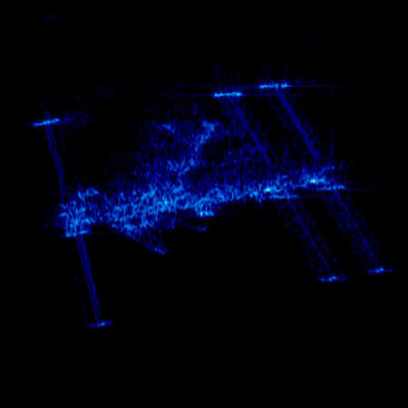 Dies ist ein ganz ungewöhnlicher Schnappschuss der ISS – aufgenommen vom Radarsatelliten TerraSAR-X, der eigentlich die Erde beobachtet. Doch am 13. März 2008 geriet die ISS ins Blickfeld des Satelliten, so dass diese seltene Aufnahme entstand. Im Gegensatz zu optischen Kameras sieht das Radar nicht Flächen, sondern vorzugsweise Ecken und Kanten, an welchen das gesendete Mikrowellen-Signal zurückgeworfen wird. So erkennt man auf dem Radarbild eher die Umrisse der ISS, die dadurch etwas „gespenstisch“ aussieht. 
Bild: DLR