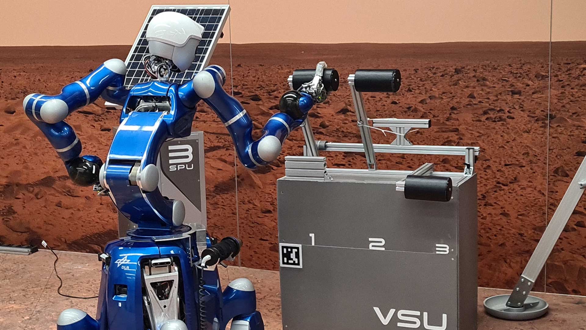 Der humanoide Roboter Rollin’ Justin interagiert mit einem Objekt