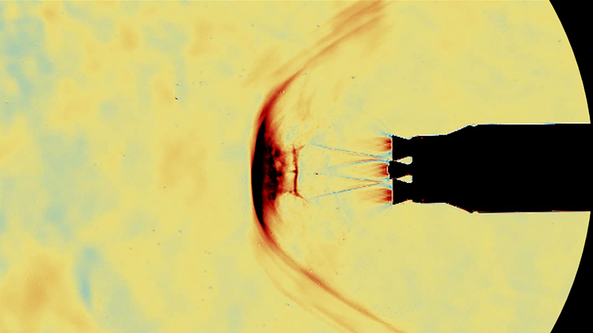 Modell einer wiederverwendbaren Raketenstufe mit drei aktiven Triebwerken beim Wiedereintritt in die Erdatmosphäre mit siebenfacher Schallgeschwindigkeit im Hyperschall Windkanal in Köln