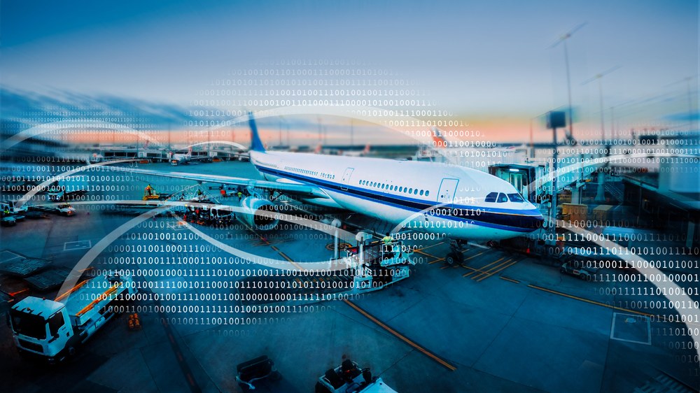 Ein Flugzeug am Gate. Linien deuten Datenverbindungen an.