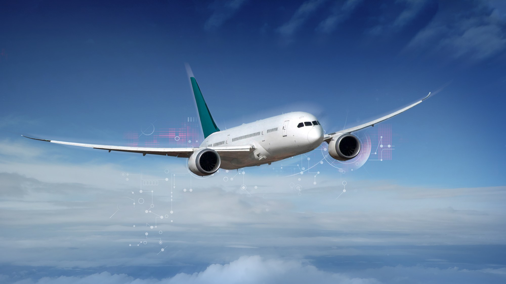 Weißes Flugzeug vor blauem Himmel