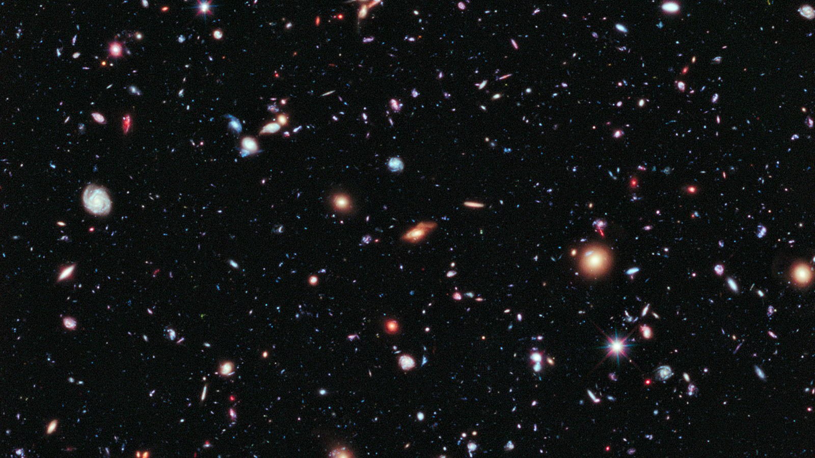 Diese Aufnahme des Weltraum-Teleskops Hubble zeigt Galaxien, die teilweise über 13 Milliarden Lichtjahre von der Erde entfernt sind
