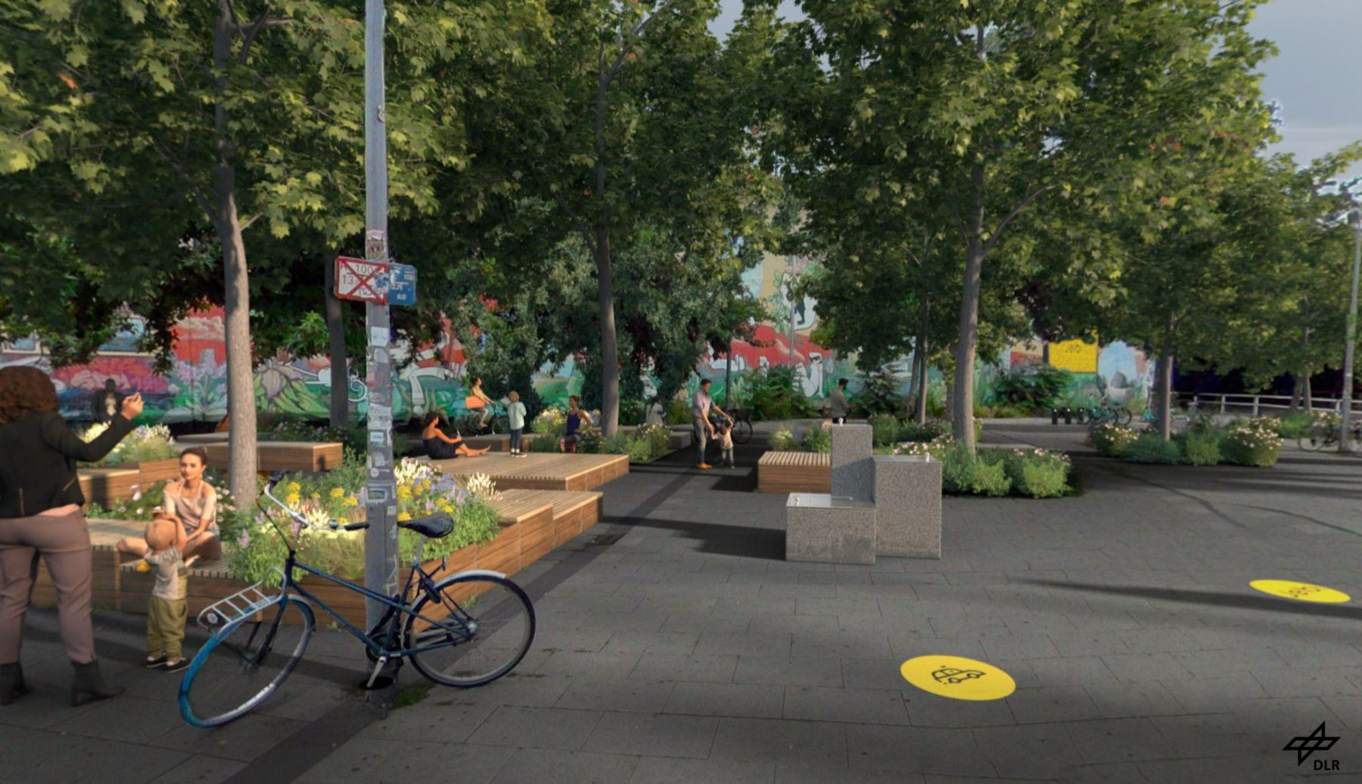 Auf einem Vorplatz eines Bahnhofes in Berlin-Lichtenberg sind mittels 3D Verschönerungsoptionen hinzugefügt worden. Hierbei handelt es sich um runde Fußbodenmarkierungen als Wegweiser und hölzerne Sitzbänke um Pflanzen-Beete herum.