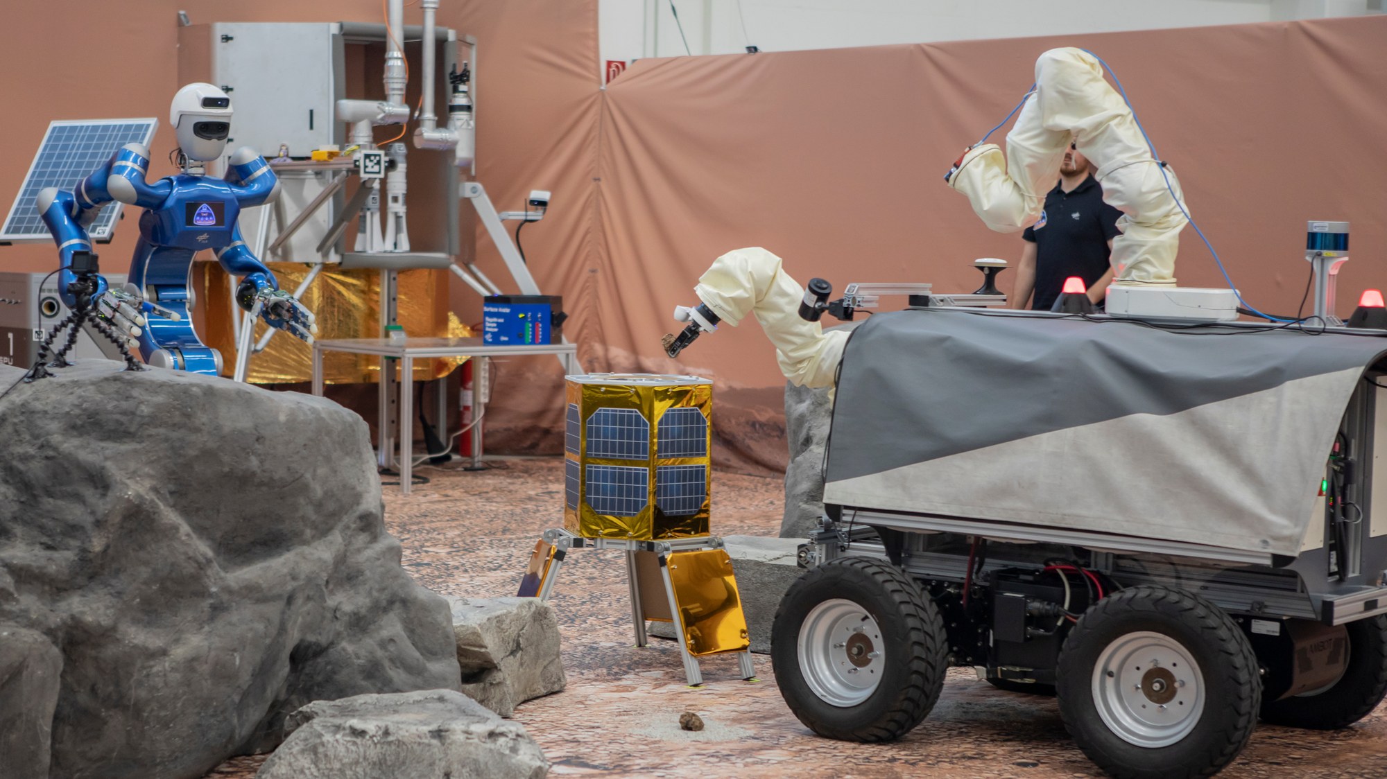 The ESA Interact rover brings a rock sample to the landing module