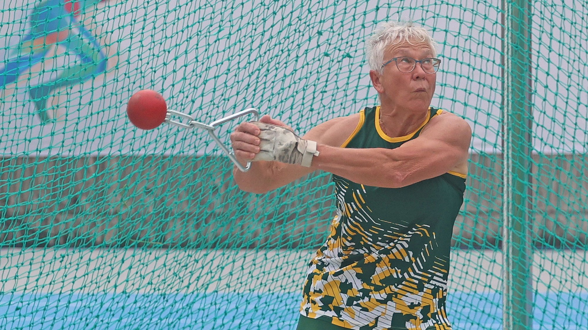 Senior athlete competing in the hammer throw