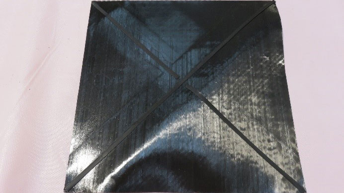 automated application of elastomer crosses within CFRP fabrics