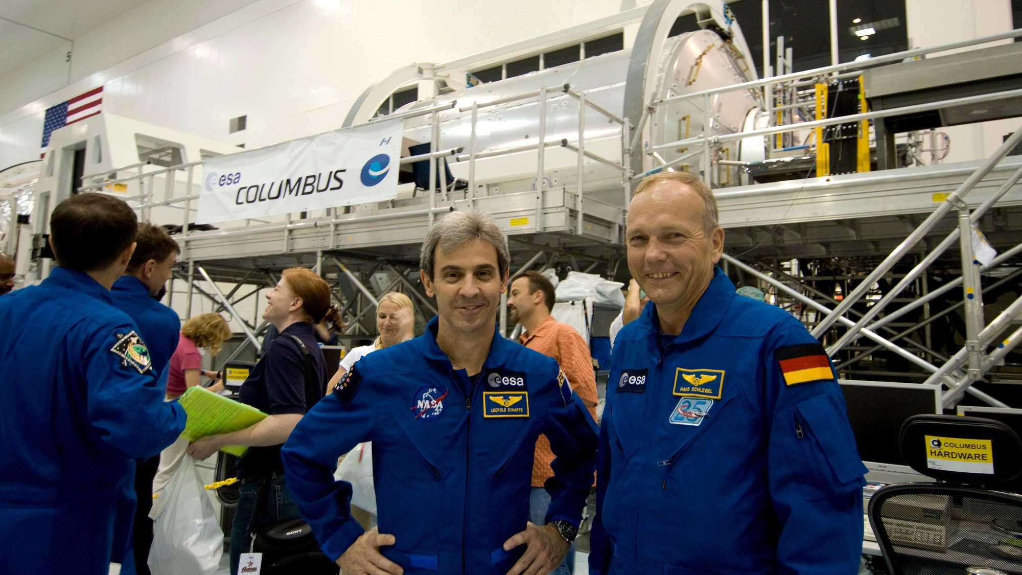 ESA astronauts Léopold Eyharts (left) and Hans Schlegel (right) in front of the Columbus laboratory