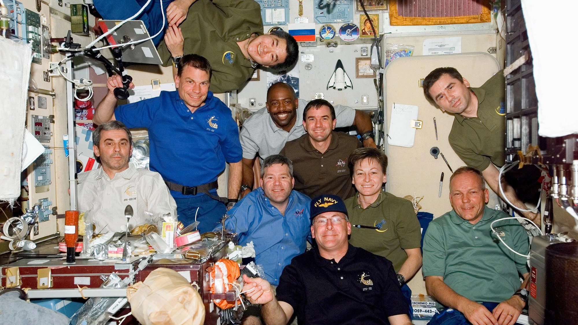 The STS-122 crew and the resident ISS crew