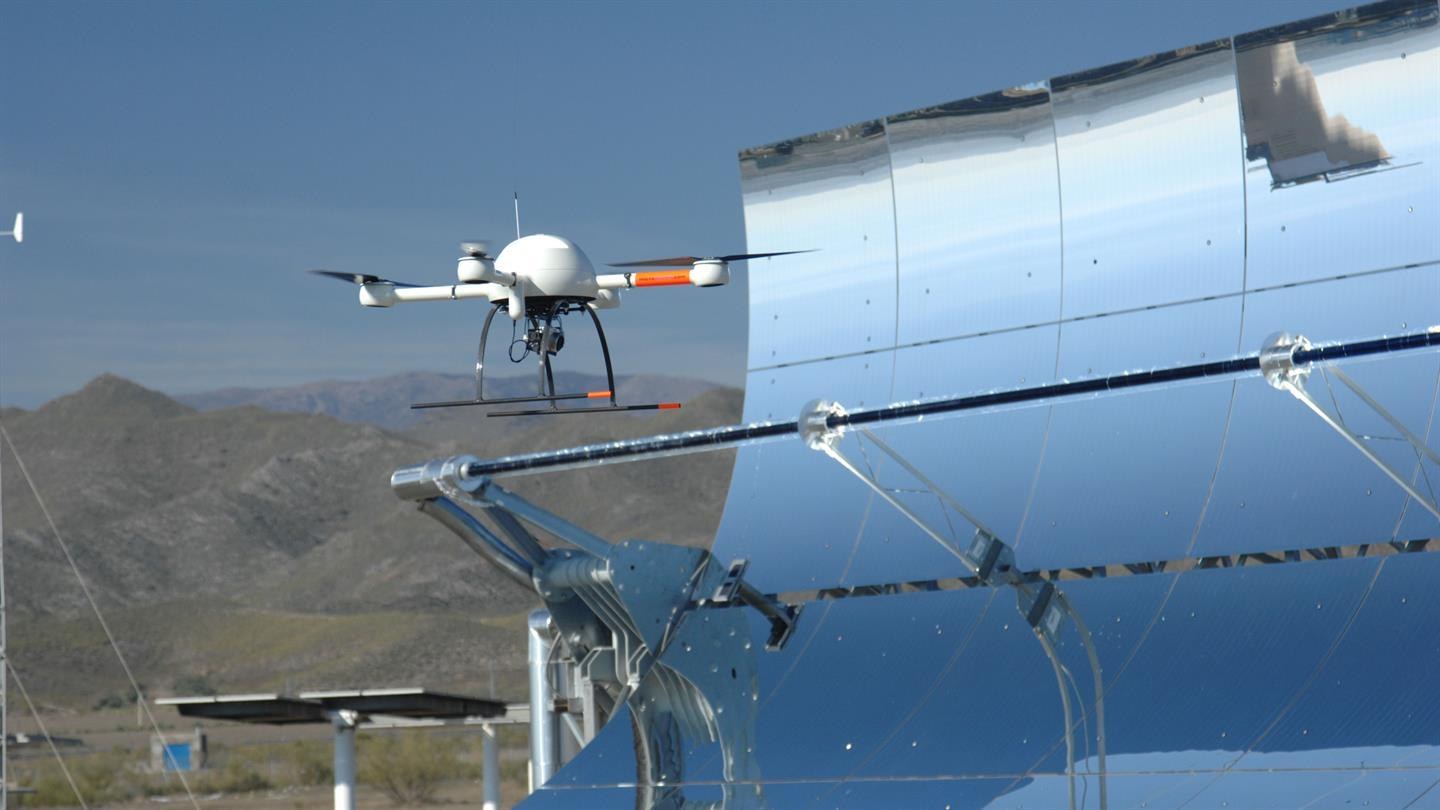 QFly flying over solar power plants