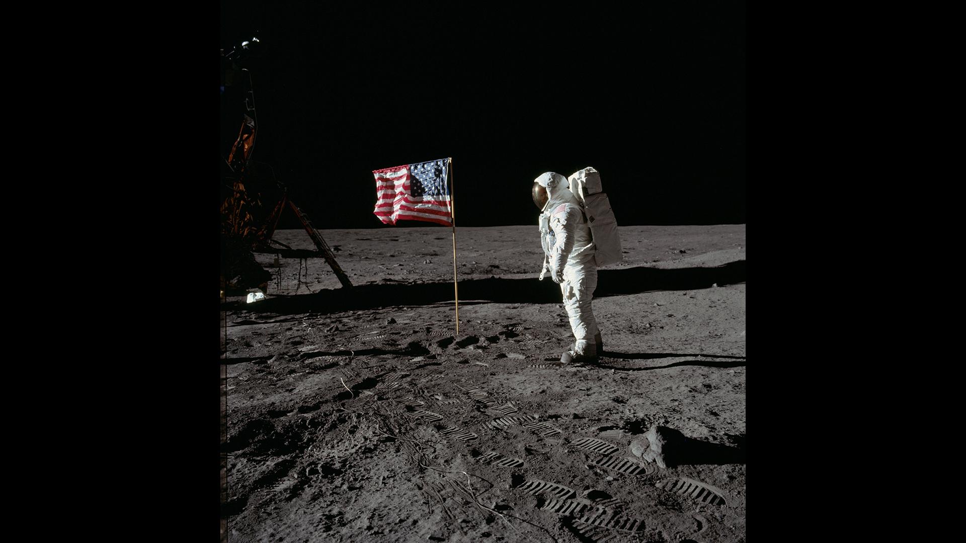 Edwin 'Buzz' Aldrin salutes the Star-Spangled Banner
