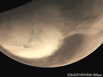 This series of images covers about 70 minutes of motion as a dust storm moves around the north polar ice cap of Mars on 29 May 2019.