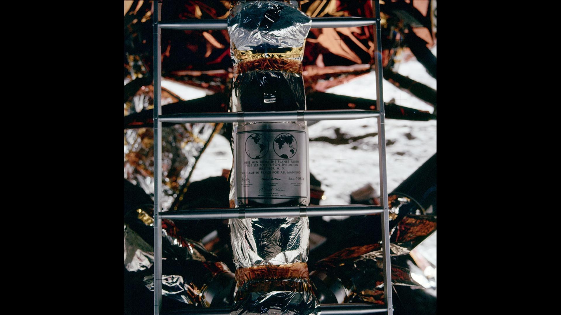 A ladder with the inscription: “Here men from planet Earth first set foot on the Moon, July 1969, A. D. We came in peace for all mankind.”