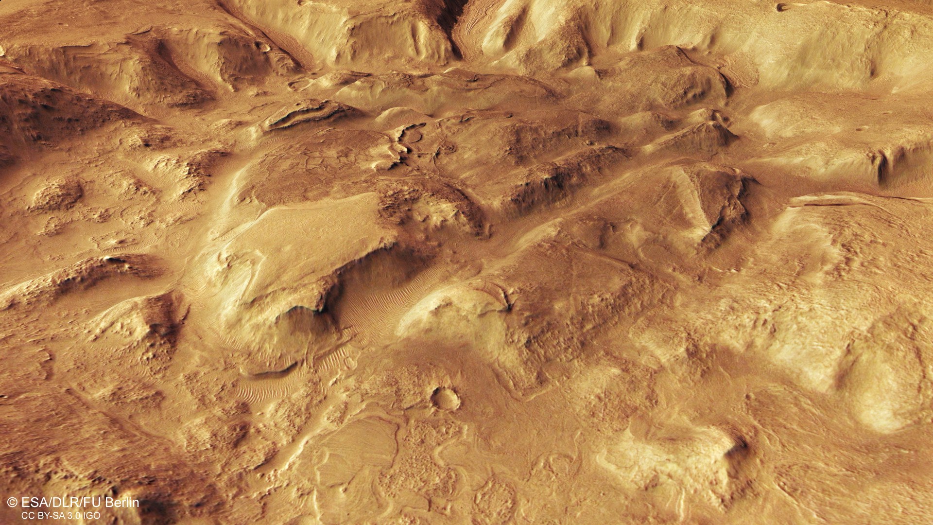 Oblique perspective view of a heavily weathered crater in Nilosyrtis Mensae