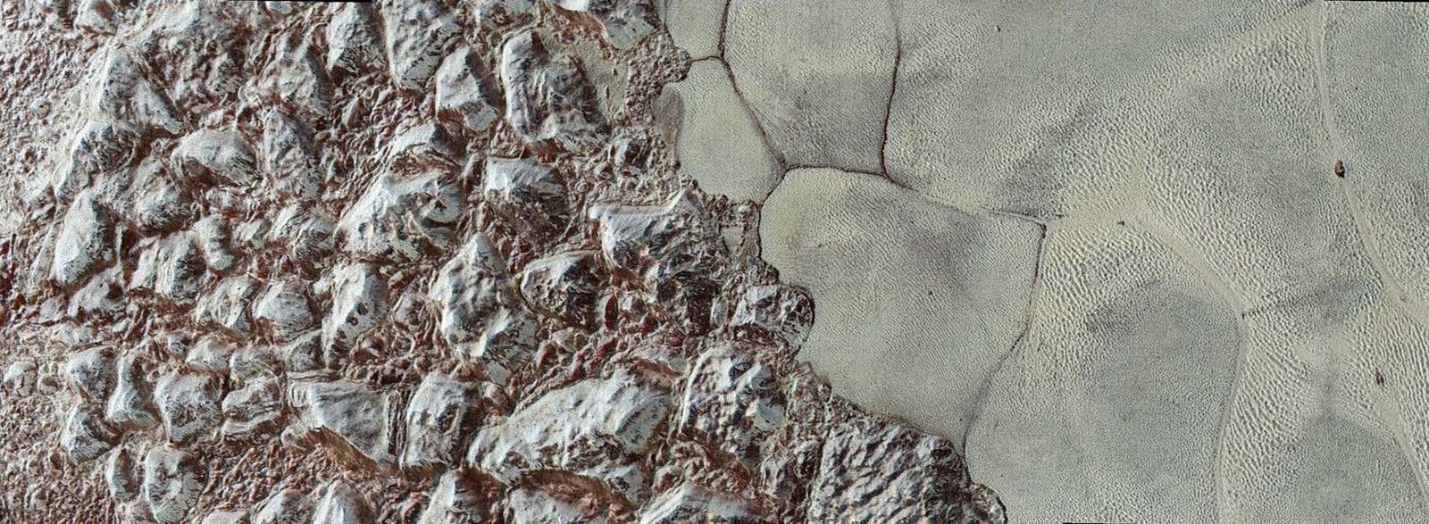 Frozen mountains on Pluto and ice polygons in Tombaugh Regio