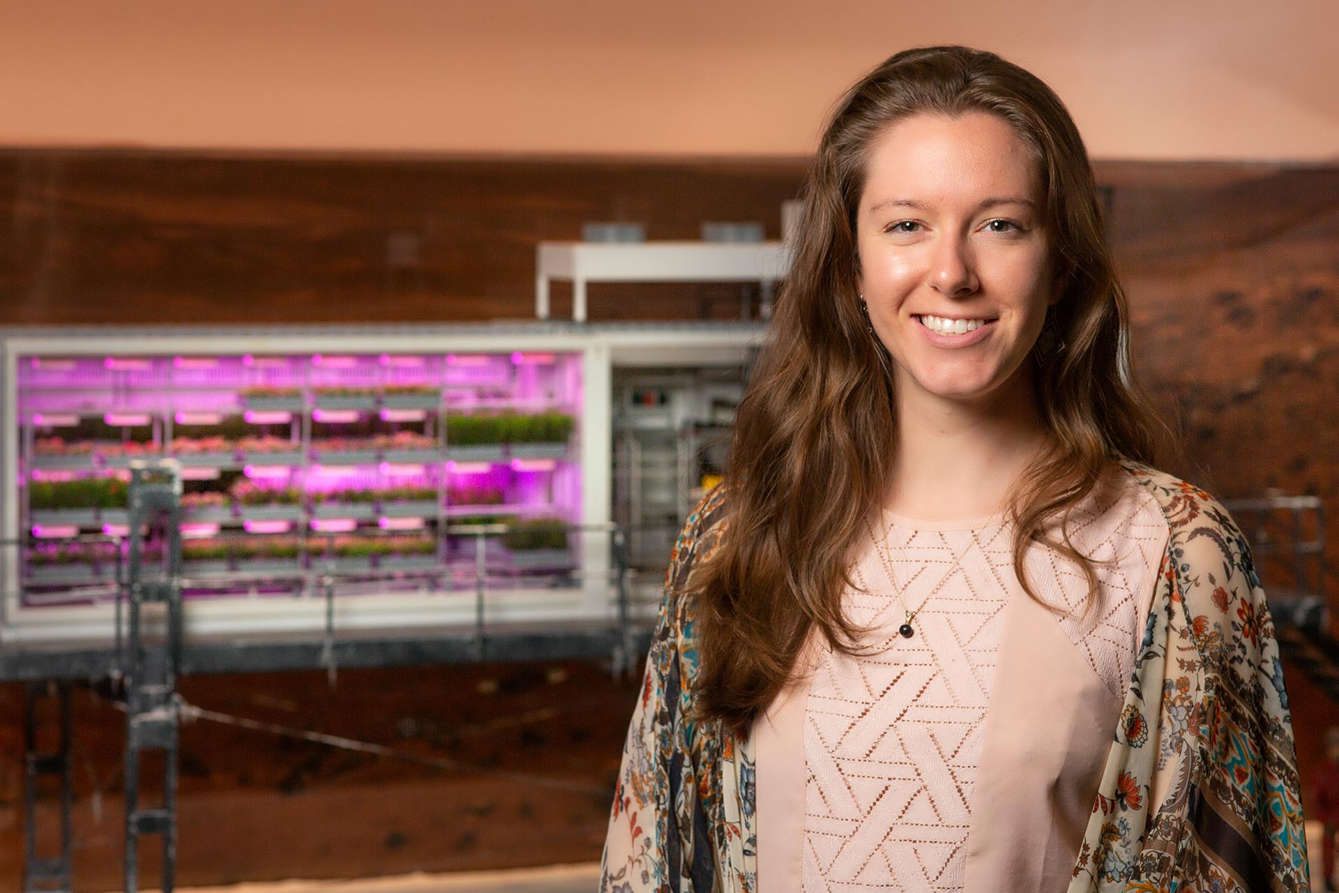 Jess Bunchek in front of the EDEN ISS Mock-Up