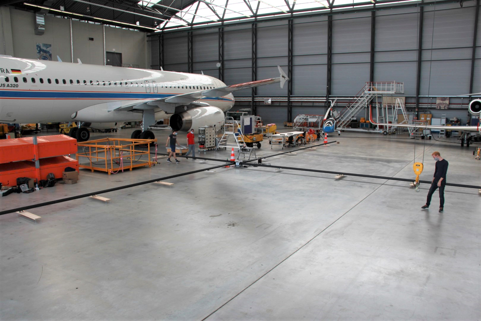 Booms forming a cross