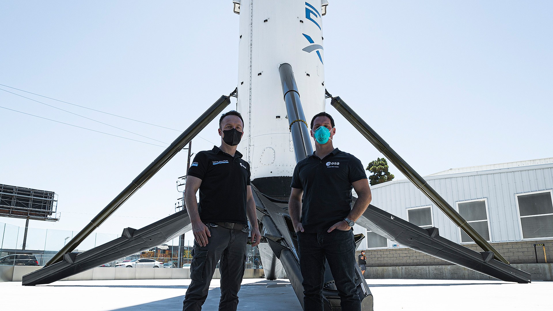 The Franco-German duo in front of a Falcon 9 rocket stage