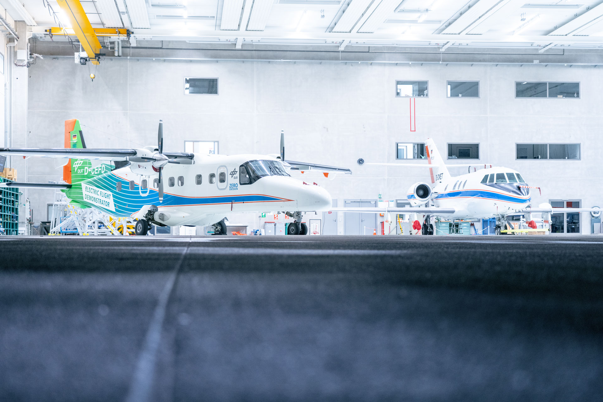 'DO 228' D-CEFD in the hangar next to the DLR Falcon D-CMET