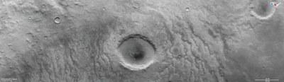 Anaglyph image of a crater in the Aonia Terra region