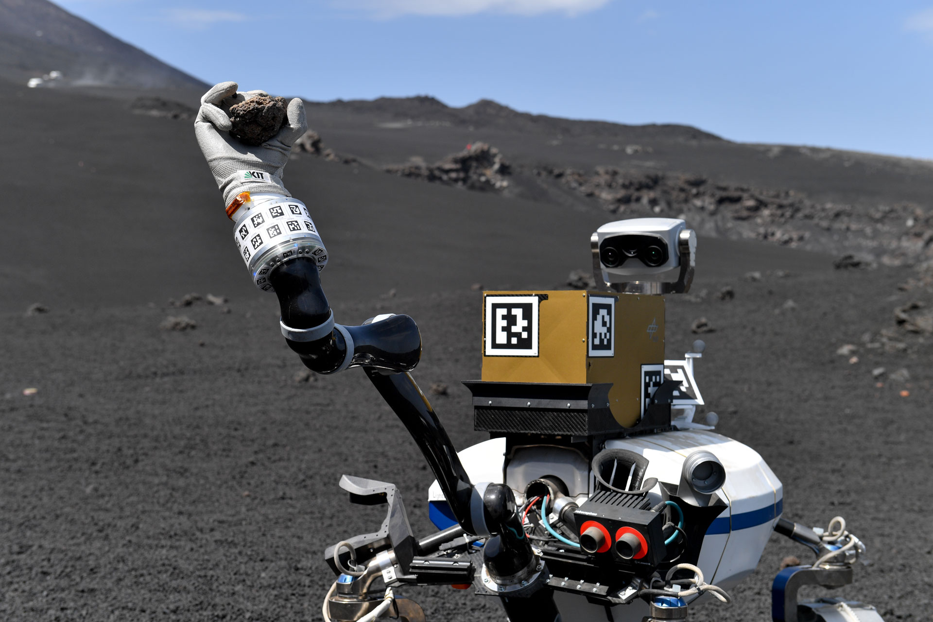 LRU2 robot taking a rock sample