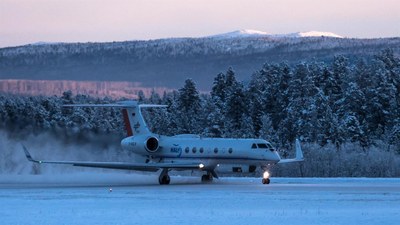 HALO research aircraft in a snow-covered landscape