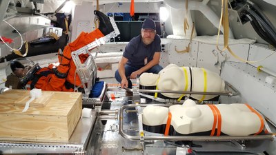 DLR radiation biologist Dr Thomas Berger with the dummies in the Orion capsule