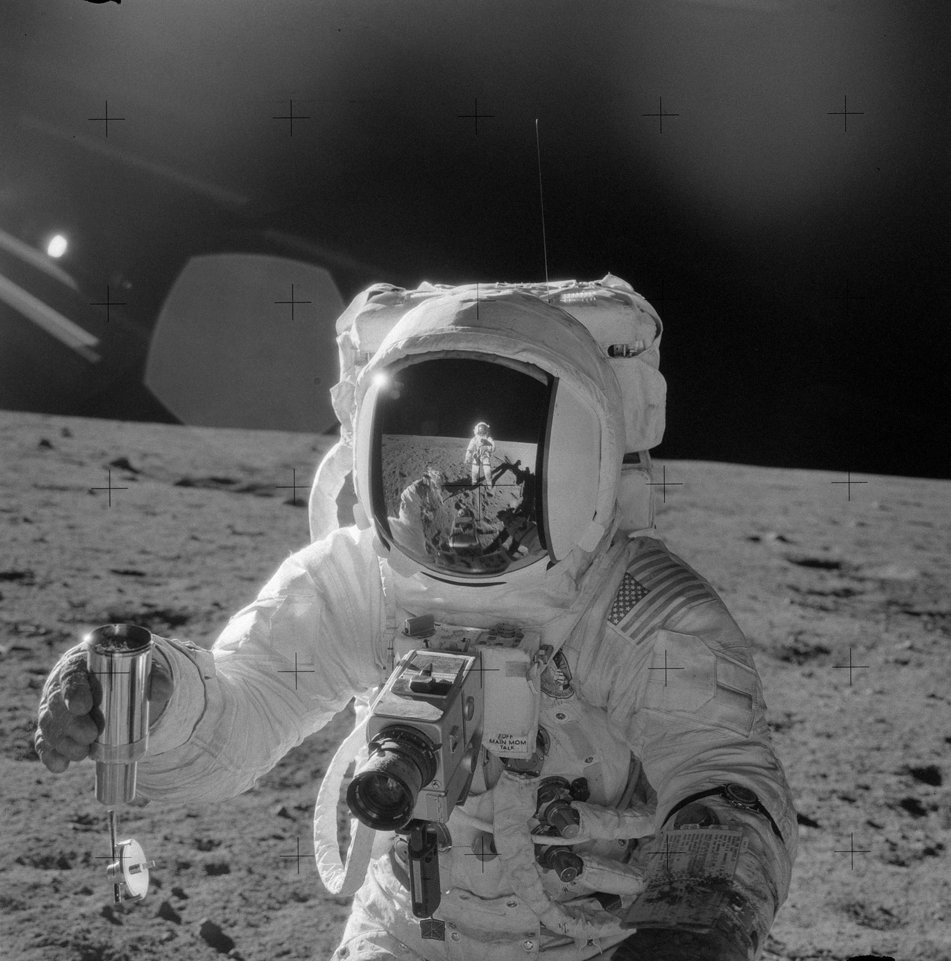 Alan Bean takes a sample of lunar soil