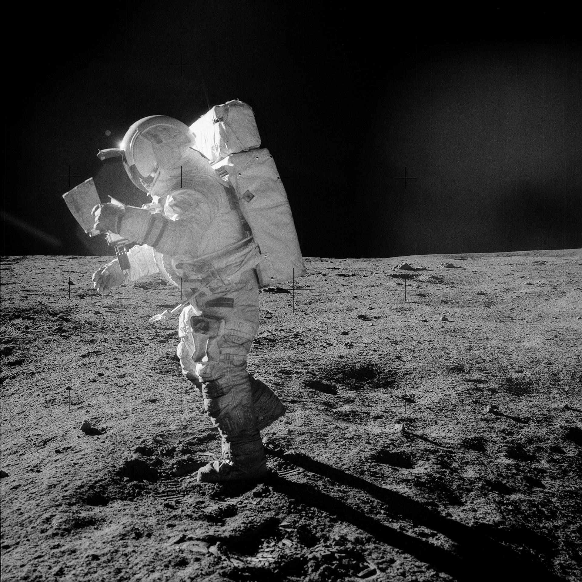 Edgar Mitchell with the map showing the route to Cone Crater