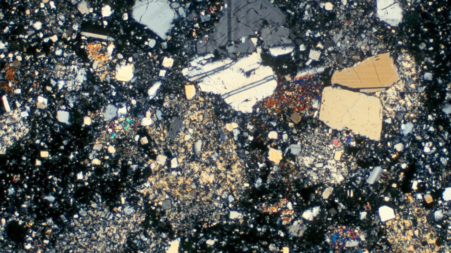 Thin slice of a rock shattered by asteroid impacts