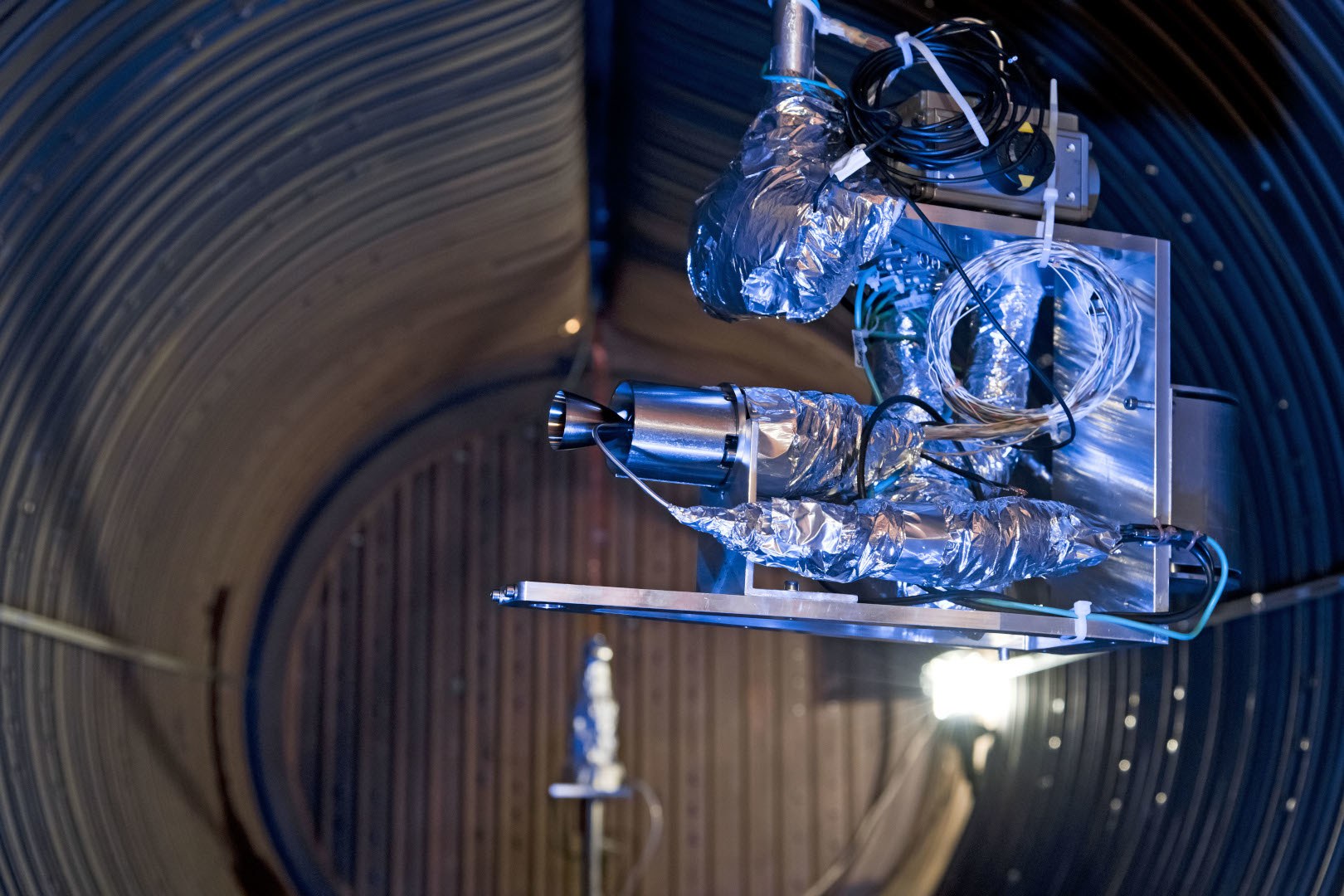 A thruster inside the test chamber