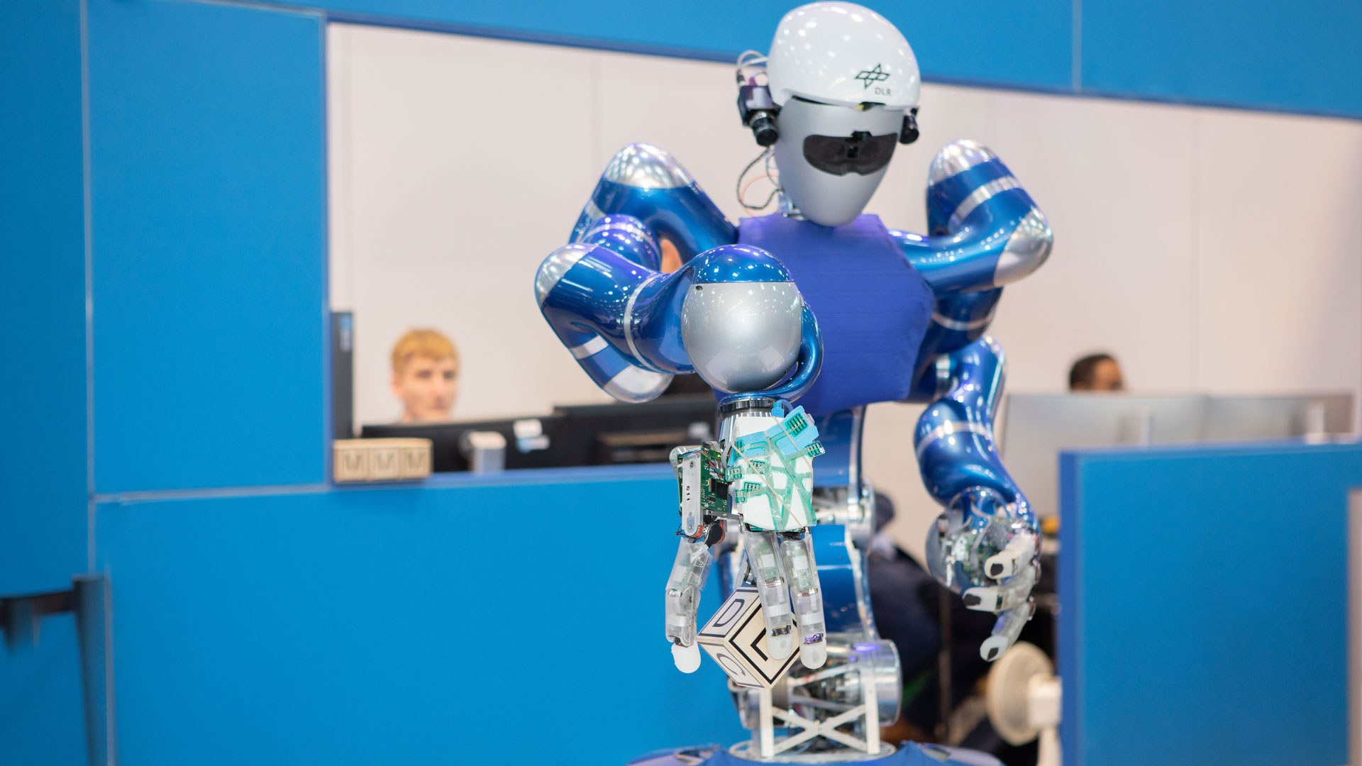 Robot Justin intuitively grasps and deftly moves objects in its hand like a human