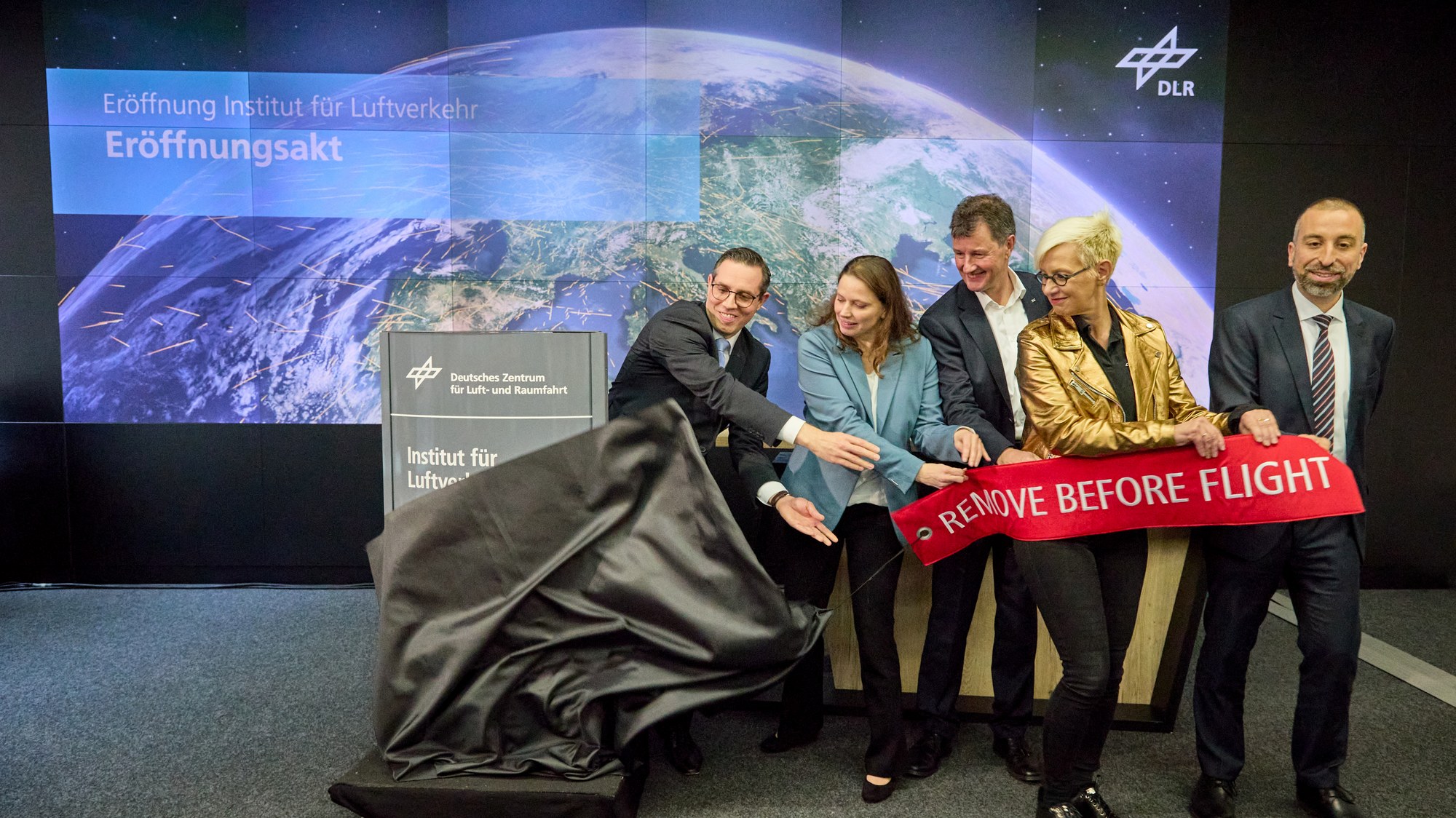 Ceremonial unveiling of the new institute sign