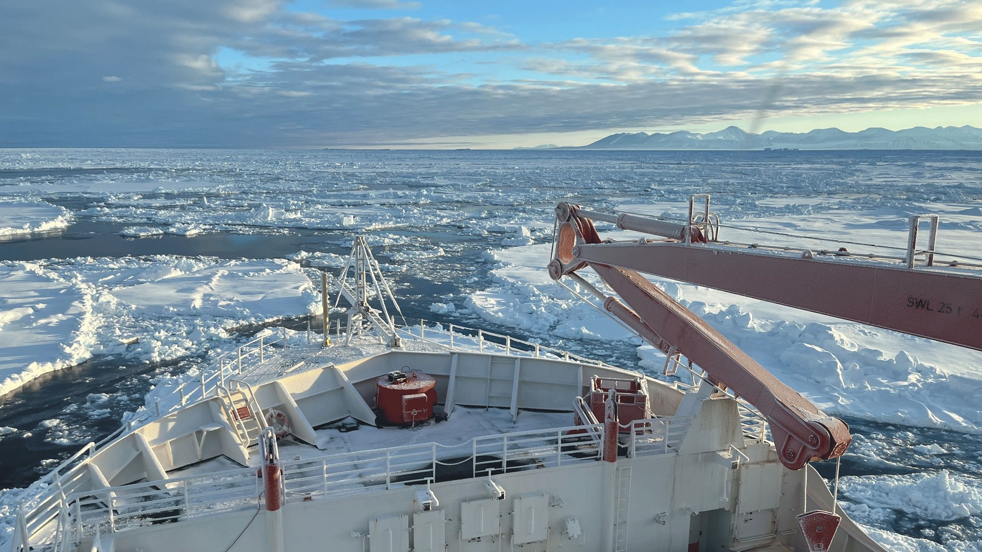 A loose cluster of ice floes with older pressure ridges