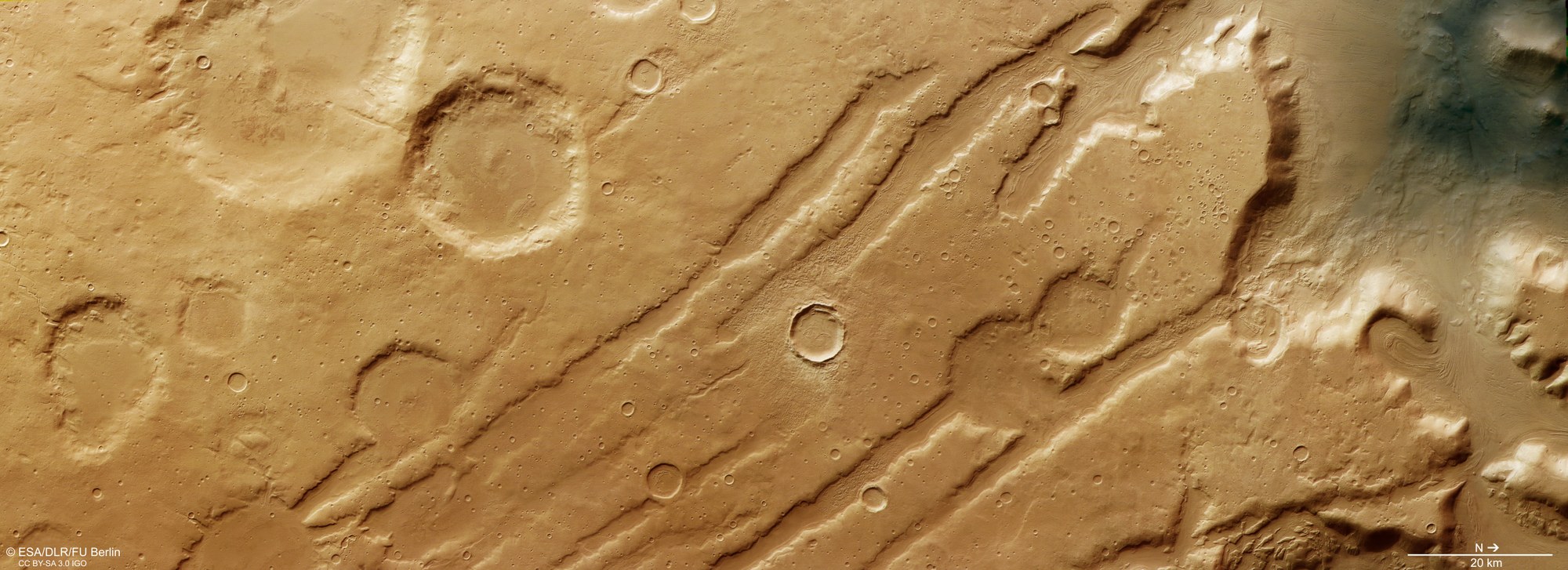 Coloe Fossae – shaped by impacts, tectonics and ice