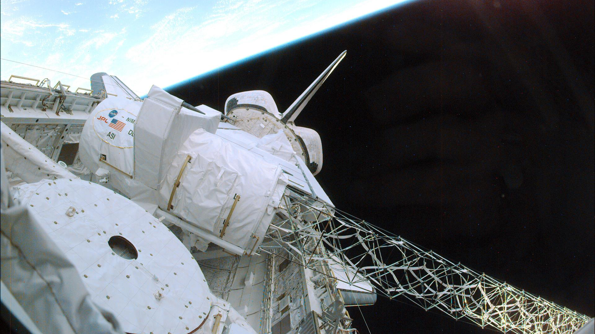 Cargo bay of the Space Shuttle Endeavour with deployed radar antenna