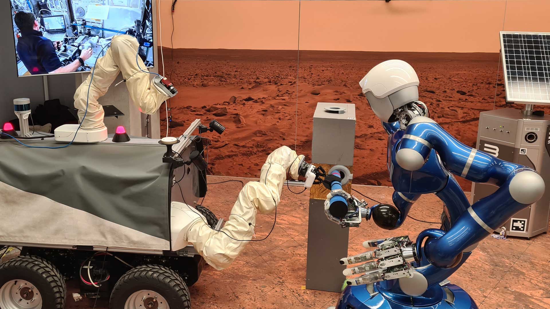 Remote-controlled from the ISS − DLR Rollin' Justin robot and the ESA Interact Rover