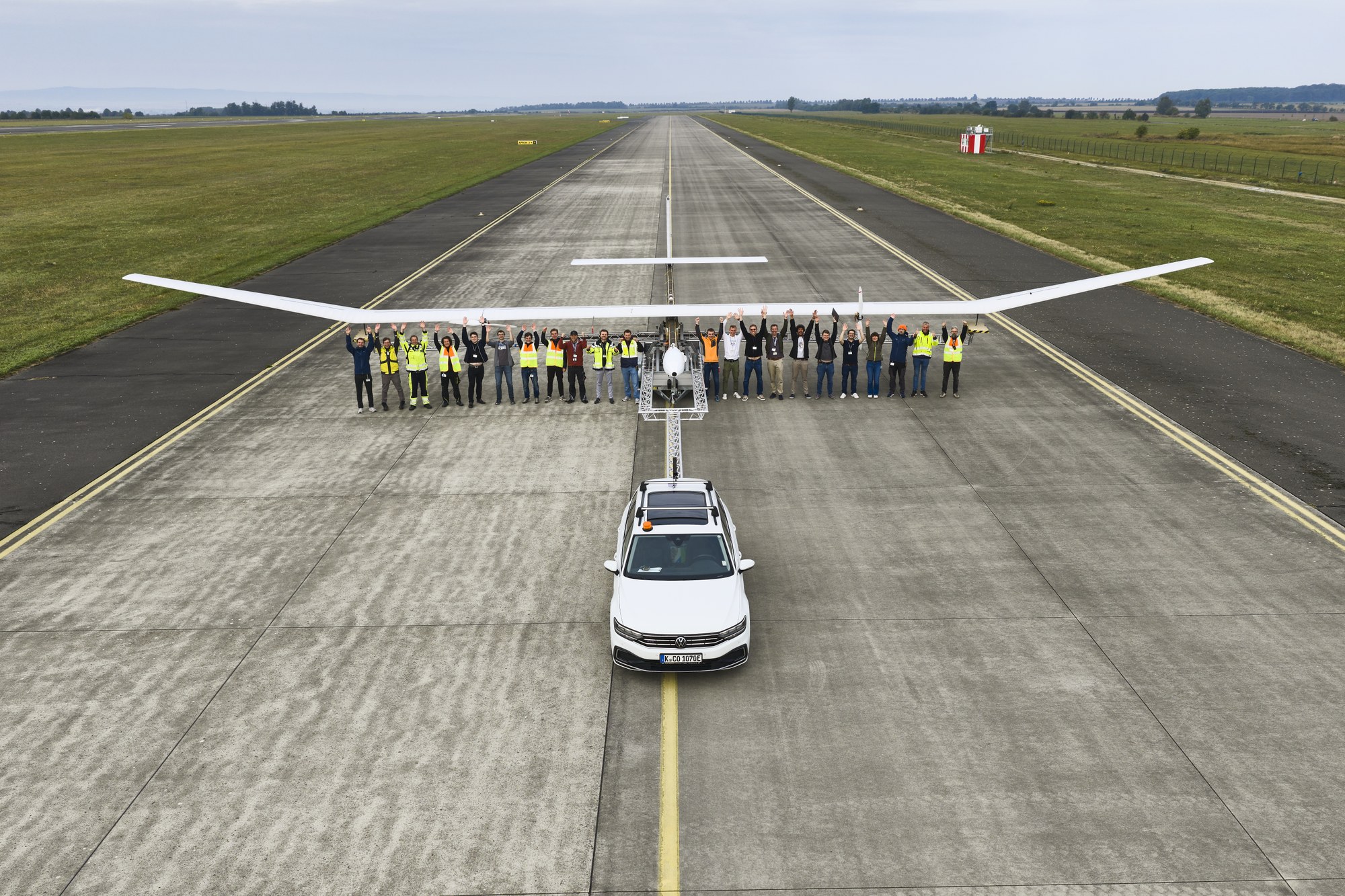 Members of the flight test and ground crews celebrate a successful first flight