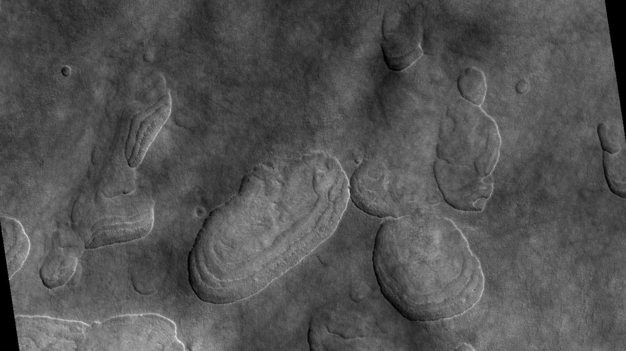 'Scalloped' depressions as indicators of subsurface ice