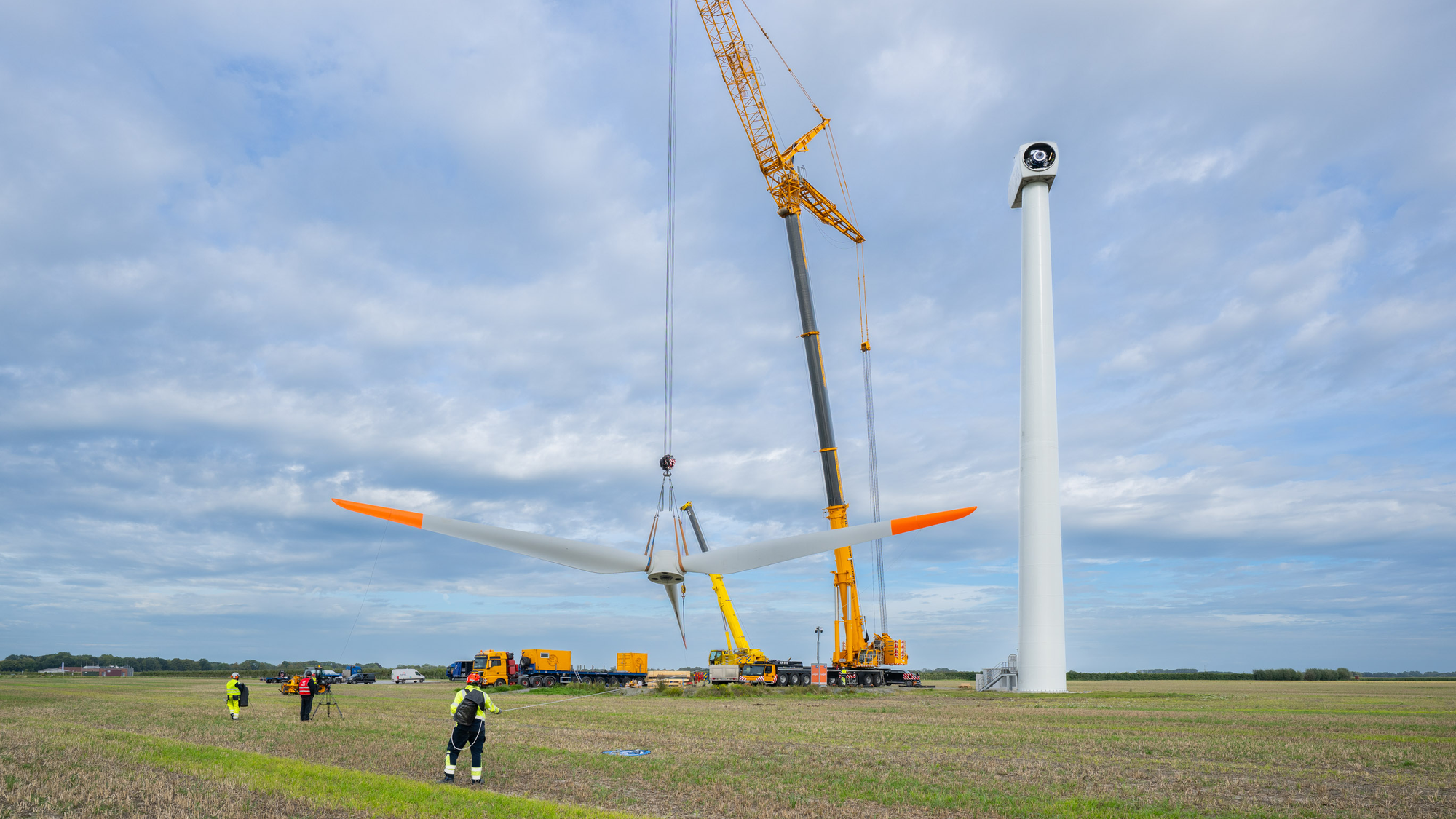 Rotor hub with blades being hoisted into place