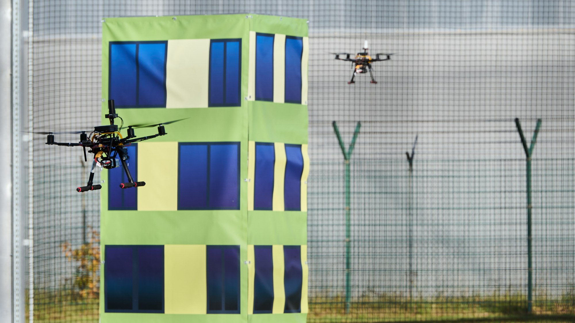 Drones during a demonstration flight in the drone cage