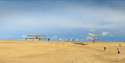 Video still: Replicas of gliders constructed by Otto Lilienthal and the Wright brothers flew together at Kitty Hawk