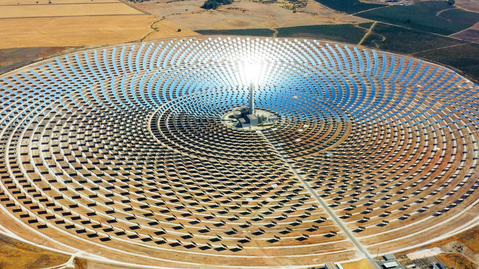 The sun is reflected in the panels, which generate renewable energy.