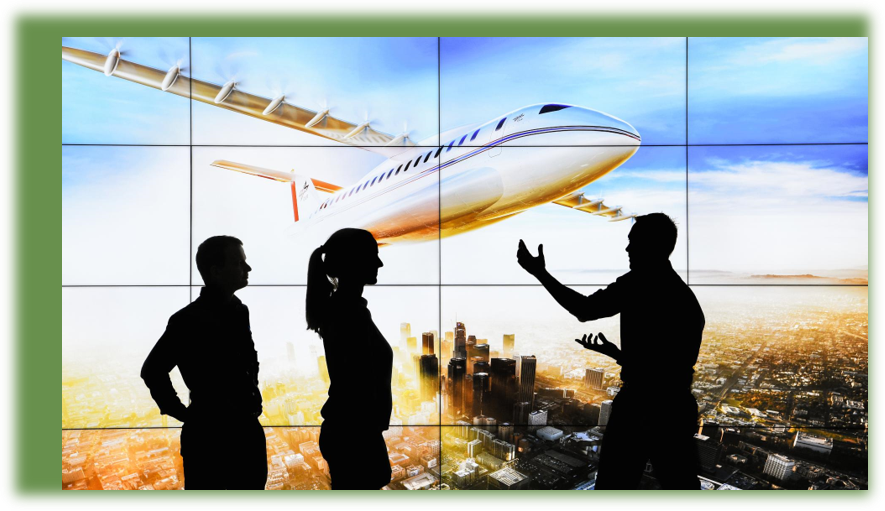 Silhouette of three people in front of a display of a plane