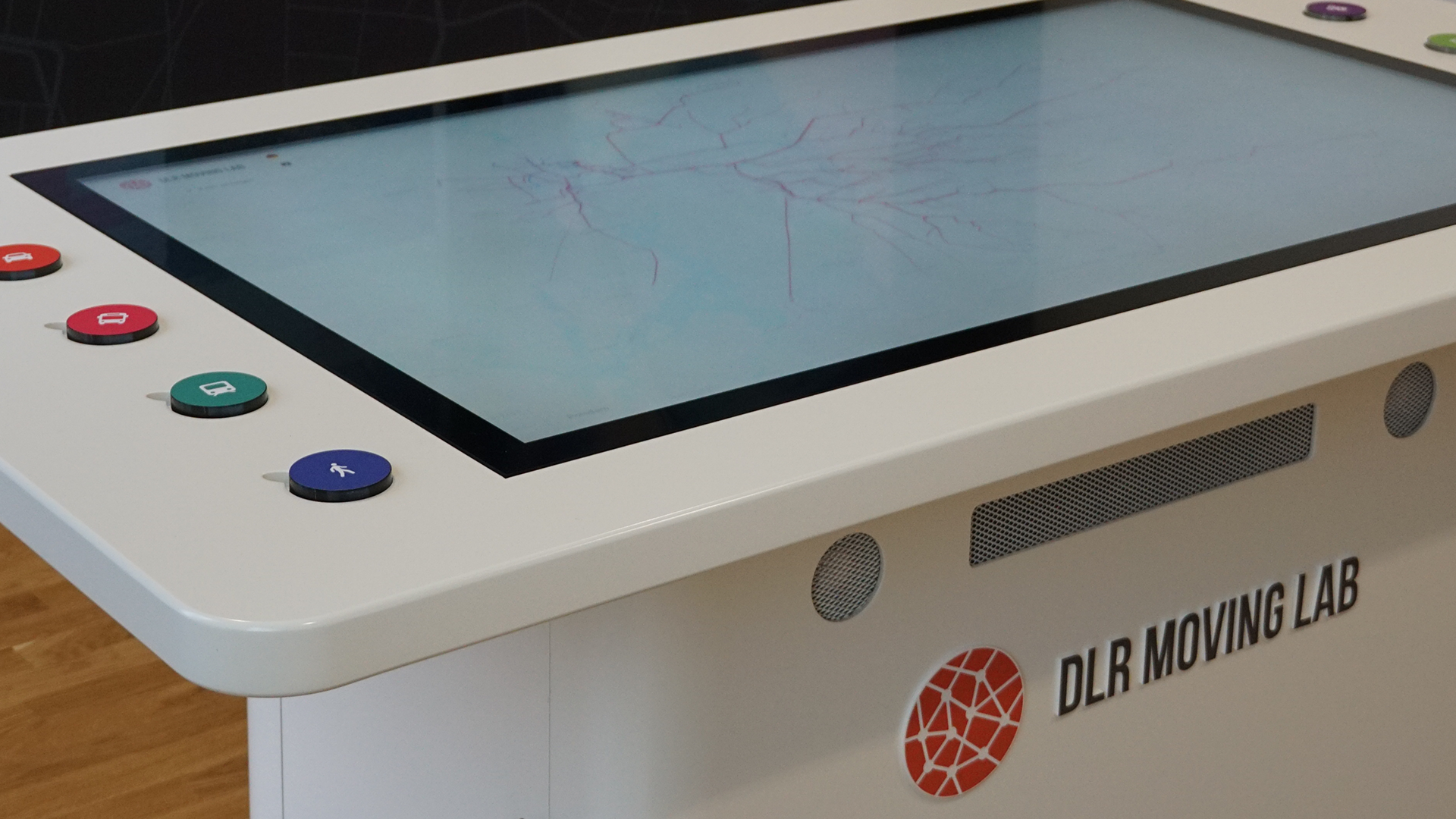 The picture shows a touch table with data analysis.