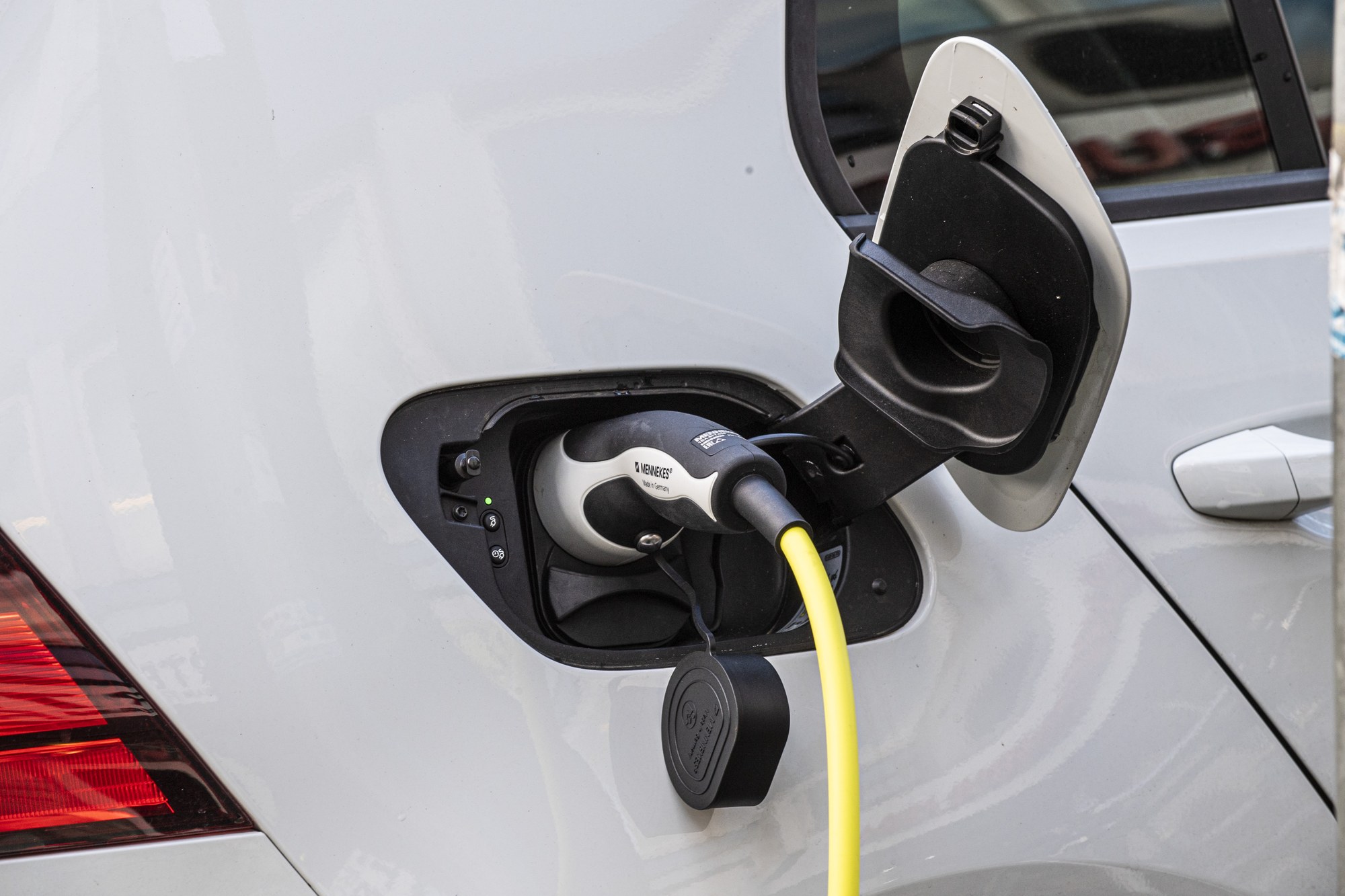 A charging cable on a car.