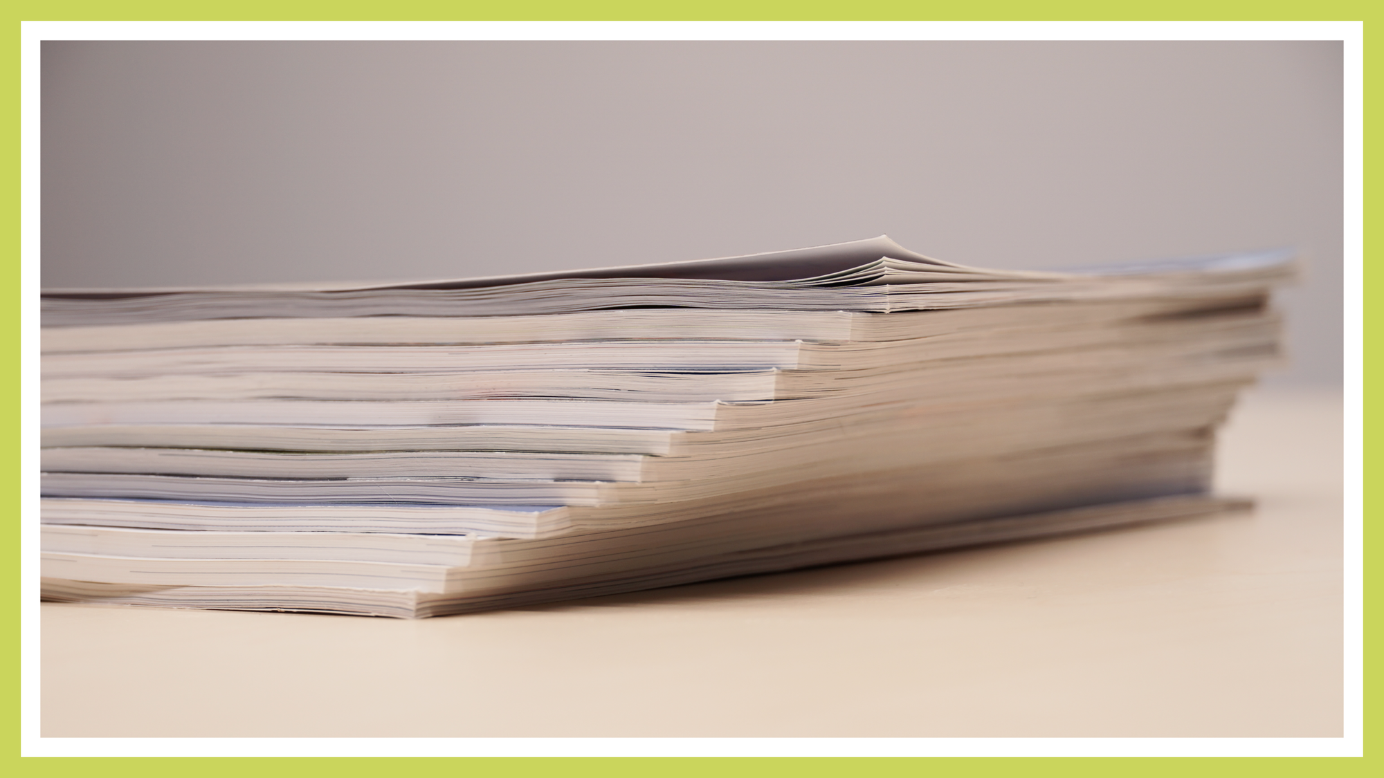 A stack of trade journals is visible, with their covers not shown.