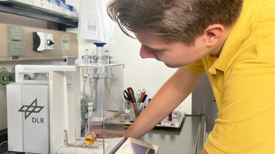 A student working on a device in a laboratory